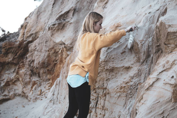 A female scientist examining rock